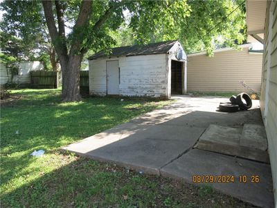 View of patio / terrace featuring a storage shed | Image 3