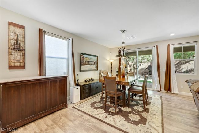 Dining space featuring visible vents, baseboards, and light wood-type flooring | Image 20