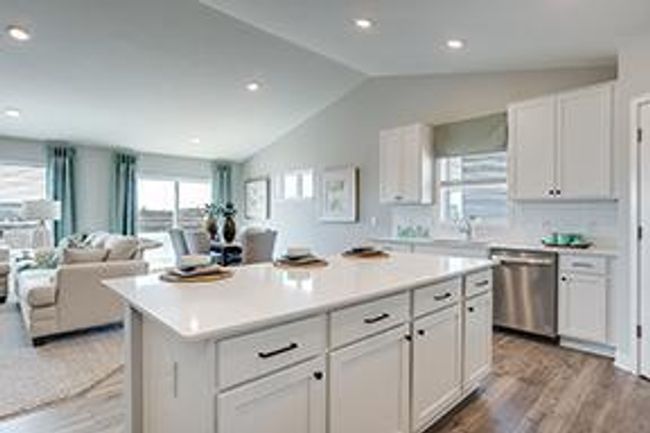 Vaulted ceilings and amazing natural light make for a bright and spacious main level. Photo of model home, colors and selections shown may vary | Image 6