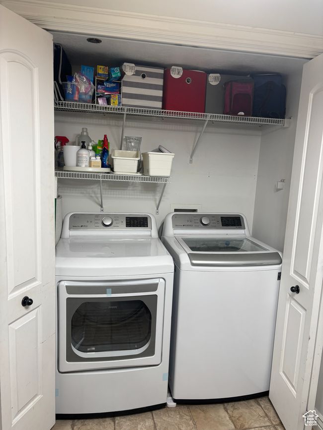 Washroom featuring washer and clothes dryer | Image 16