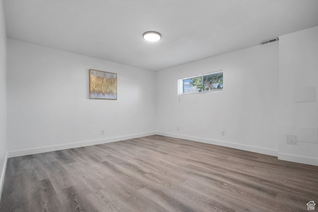 Empty room with wood finished floors | Image 6