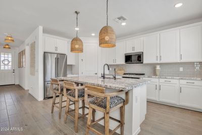 Practically brand new, white shaker cabinets and granite countertops! | Image 3