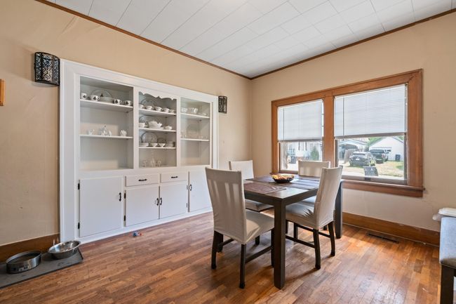 Dining space featuring ornamental molding, hardwood / wood-style floors, and baseboards | Image 26
