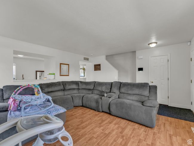 Living room featuring wood finished floors | Image 7