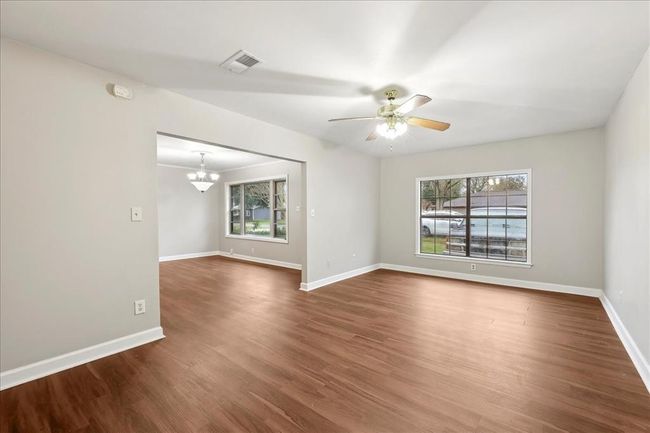 Second sitting area with large windows and open floor | Image 12