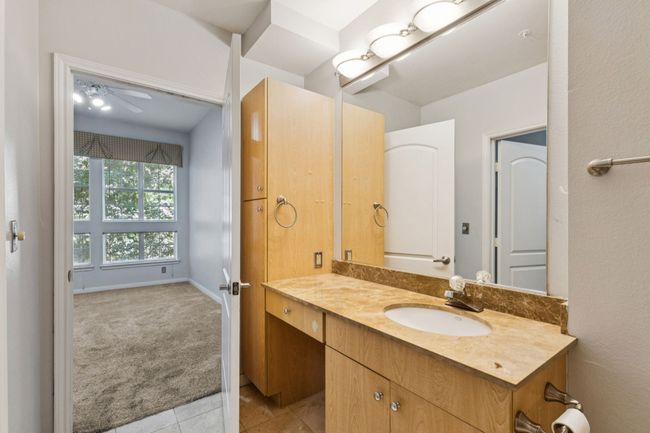 Bathroom featuring vanity and tile patterned flooring | Image 18