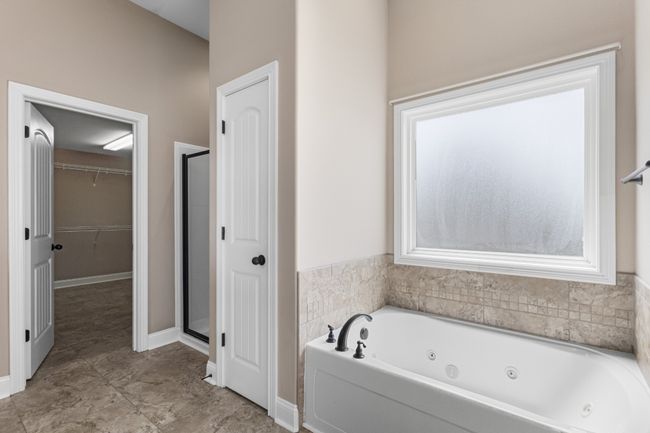 Jetted Tub with Frosted Window, Linen Closet, Separate Shower and a Walk-in Closet! | Image 21