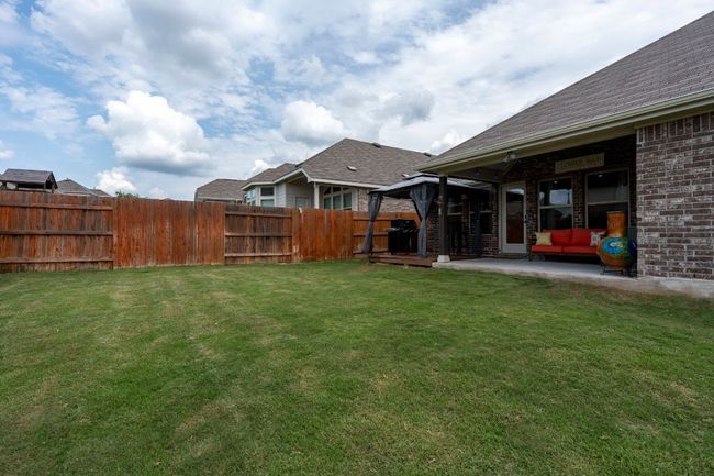 View of yard with a gazebo, a patio area, and an outdoor living space | Image 26