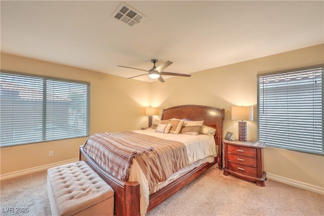 Bedroom featuring light carpet and a ceiling fan | Image 20
