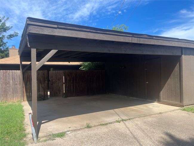 View of parking / parking lot with a carport | Image 16