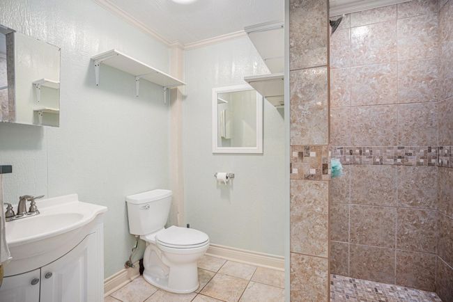 The full bathroom features a shower. | Image 40