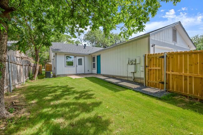 Back of property featuring a gate and a fenced backyard | Image 22