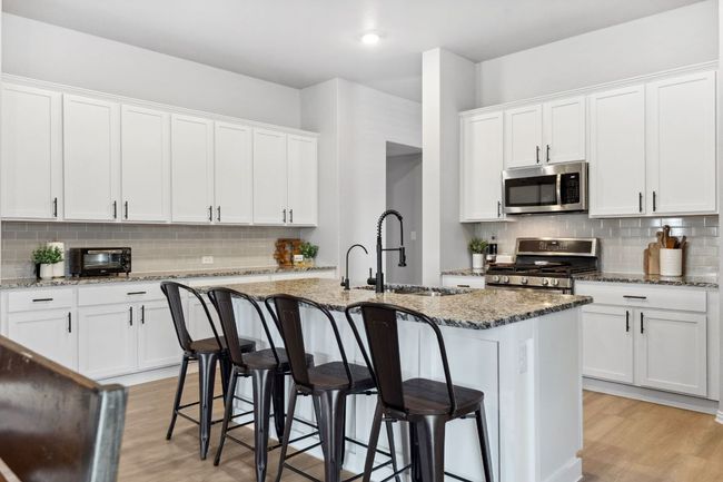 Abundant cabinetry provides you with endless kitchen storage space. | Image 9