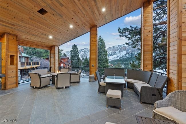 View of patio with a mountain view and an outdoor hangout area | Image 70