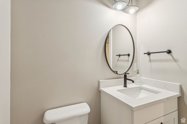 Bathroom with toilet and vanity | Image 51