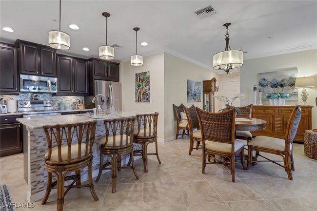 Dining room featuring baseboards, visible vents, recessed lighting, and ornamental molding | Image 6