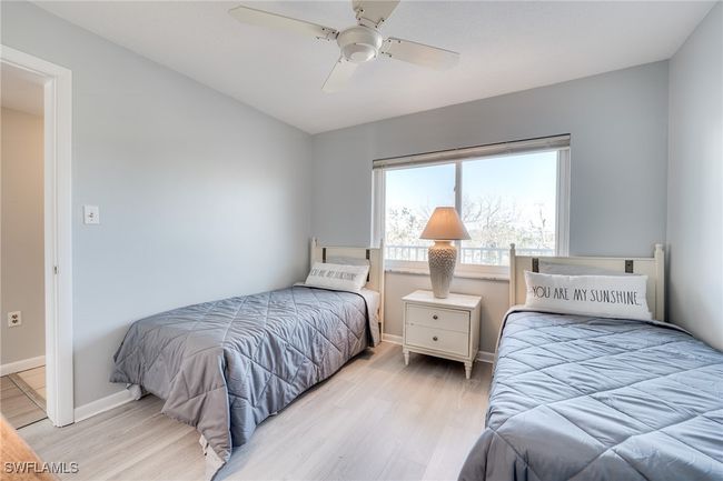 Bedroom featuring ceiling fan and light wood-type flooring | Image 29
