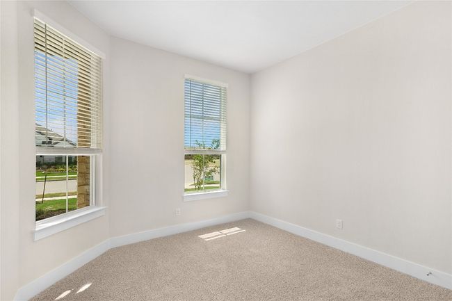 Carpeted spare room with healthy amount of natural light and baseboards | Image 4