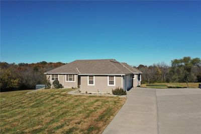 Single story home featuring a front yard and a garage | Image 3