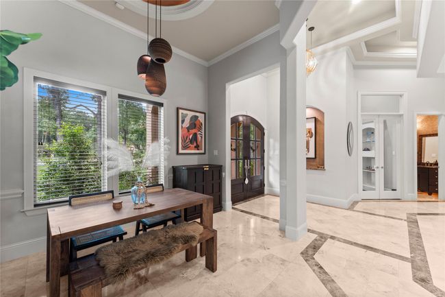 The dining area opens seamlessly to the main living spaces, fostering an open and connected atmosphere perfect for entertaining. | Image 21
