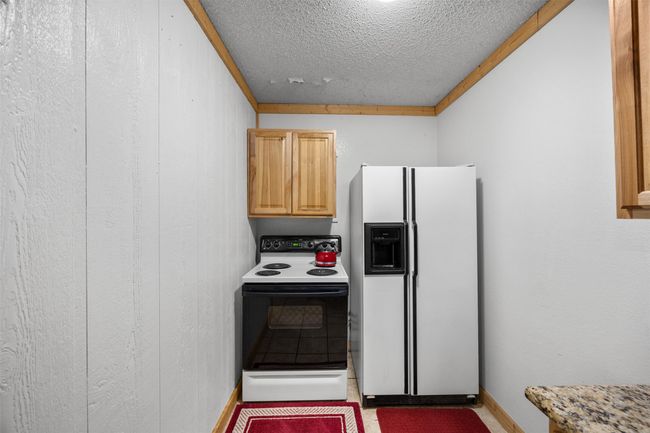 Kitchen with room for cooktop stove and frig | Image 9