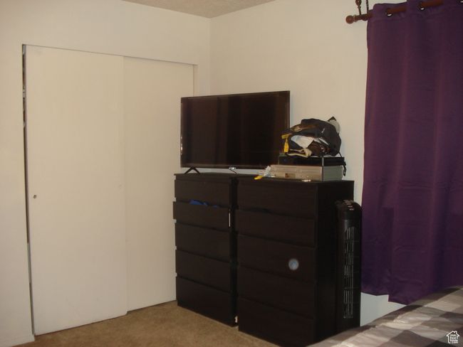 Carpeted bedroom featuring a closet | Image 13