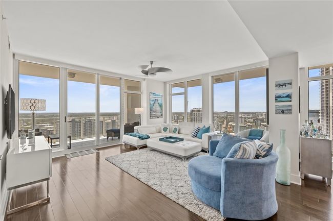 Open floor plan with high ceilings and window walls | Image 9