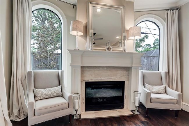 Private fireplace in the primary bedroom. | Image 19
