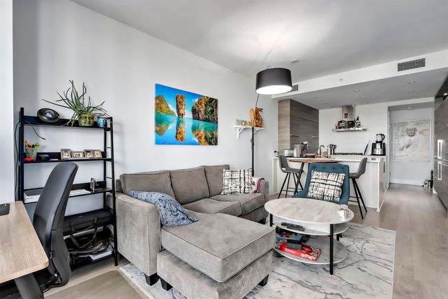 Living area with visible vents and light wood finished floors | Image 5