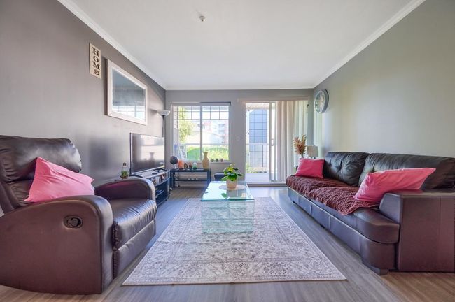 Living room featuring crown molding and wood finished floors | Image 4