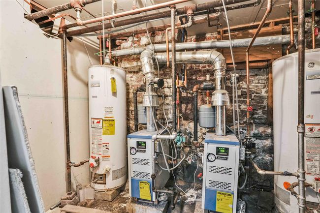 Utilities featuring gas water heater | Image 14