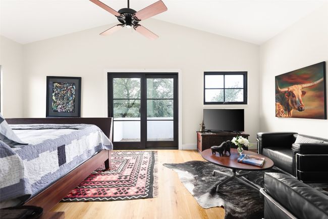 Bedroom with vaulted ceiling and access to balcony | Image 26