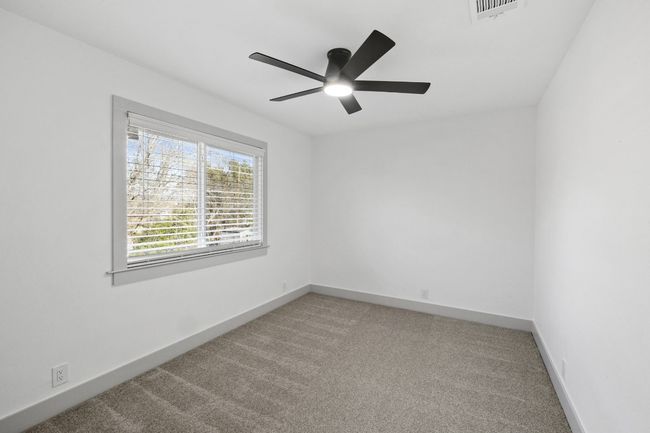 The third additional bedroom has a ceiling and a nice closet. The room can also make a great office with a view of the backyard. | Image 26