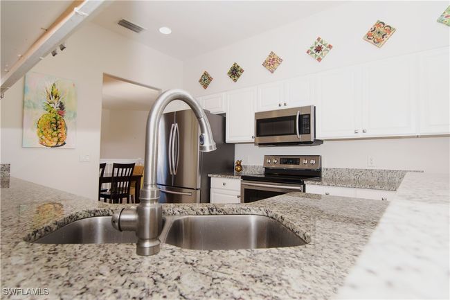 Countertop view of updated kitchen. | Image 11
