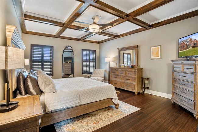 The 1st floor master is a relaxing retreat with coffered ceilings | Image 16