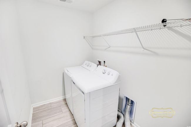 Washroom with separate washer and dryer and baseboards | Image 31