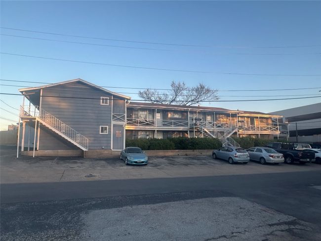 View of front of house with uncovered parking and stairway | Image 5