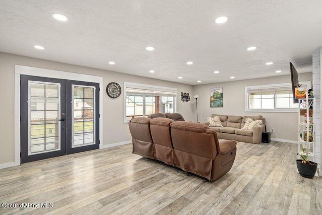 The farmhouse vibe goes throughout the house with laminate flooring, light trim and pops of color. | Image 9
