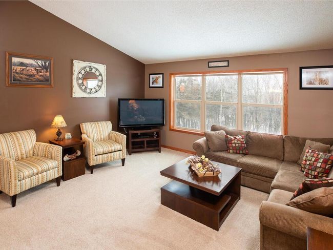 Large picture window overlooks wooded back yard | Image 24