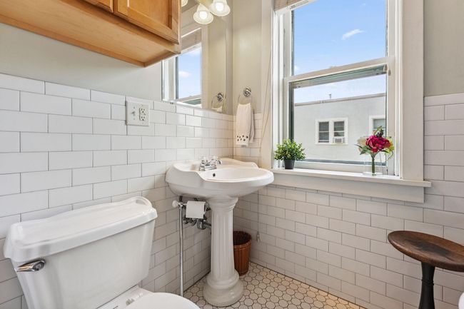 Updated bathroom with storage above the toilet | Image 17