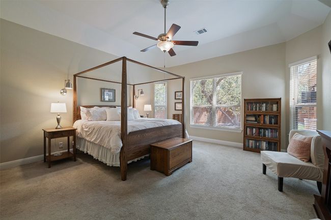 Spacious primary suite with backyard views, high ceilings, plush carpet, and perfectly positioned from the secondary bedrooms | Image 17