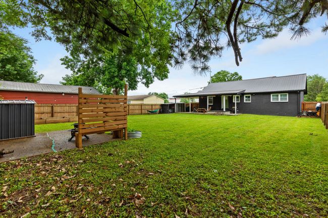 Covered back porch connects to the carport and gives plenty of area to sit and enjoy the view no matter the weather. | Image 7