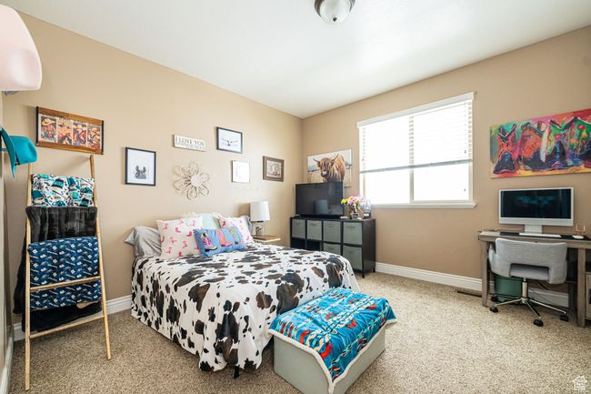 Bedroom with carpet floors and baseboards | Image 13