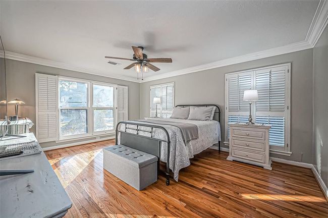 Luxurious primary suite with stunning shuttered windows. | Image 25