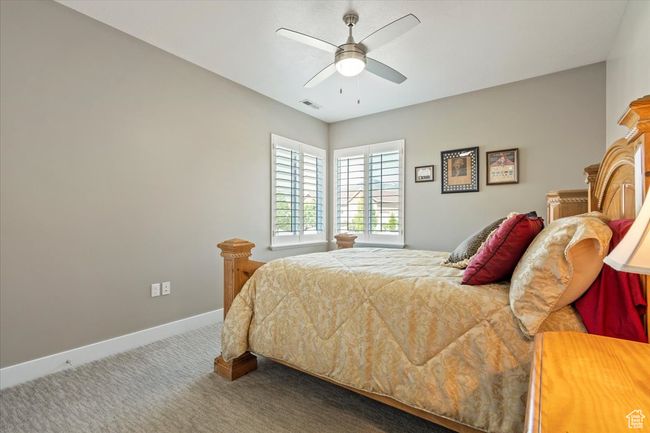 Carpeted bedroom with baseboards and a ceiling fan | Image 28