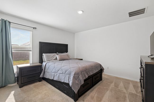 Bedroom with light carpet and visible vents | Image 9
