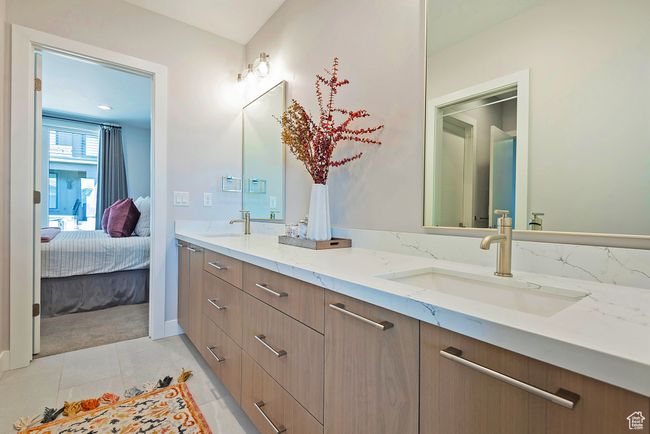 Bathroom with connected bathroom, a sink, and double vanity | Image 24