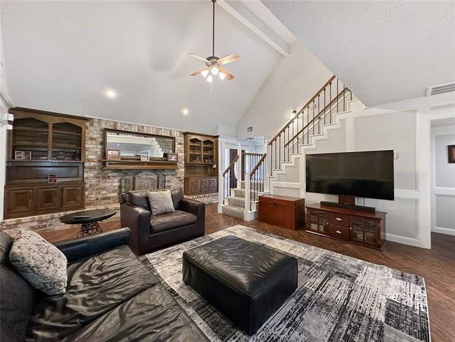 The charming living room serves as the perfect introduction to the home’s welcoming layout. | Image 12