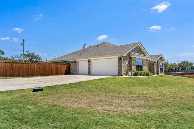 Side of home offering 3-car garage | Image 4
