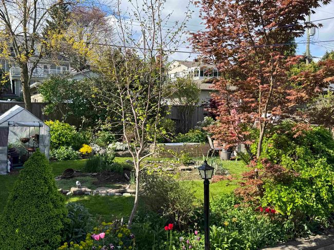 View of yard featuring fence, an outbuilding, and an exterior structure | Image 10